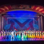 42nd Street cast wearing rainbow colours