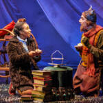 Lucy and Mr Tumnus have tea. The Lion, The Witch and The Wardrobe West End Production photograph.