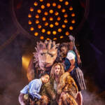 Lucy, Susan and Aslan hug. The Lion, The Witch and The Wardrobe West End Production photograph.