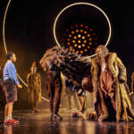 Aslan speaks with Lucy. The Lion, The Witch and The Wardrobe West End Production photograph.