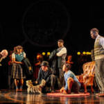 The Pevensey children talk with the Professor The Lion, The Witch and The Wardrobe West End Production photograph.